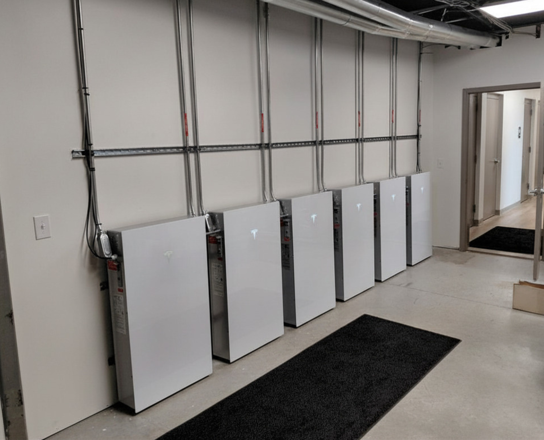 Wall of Tesla Powerwall 3 Batteries