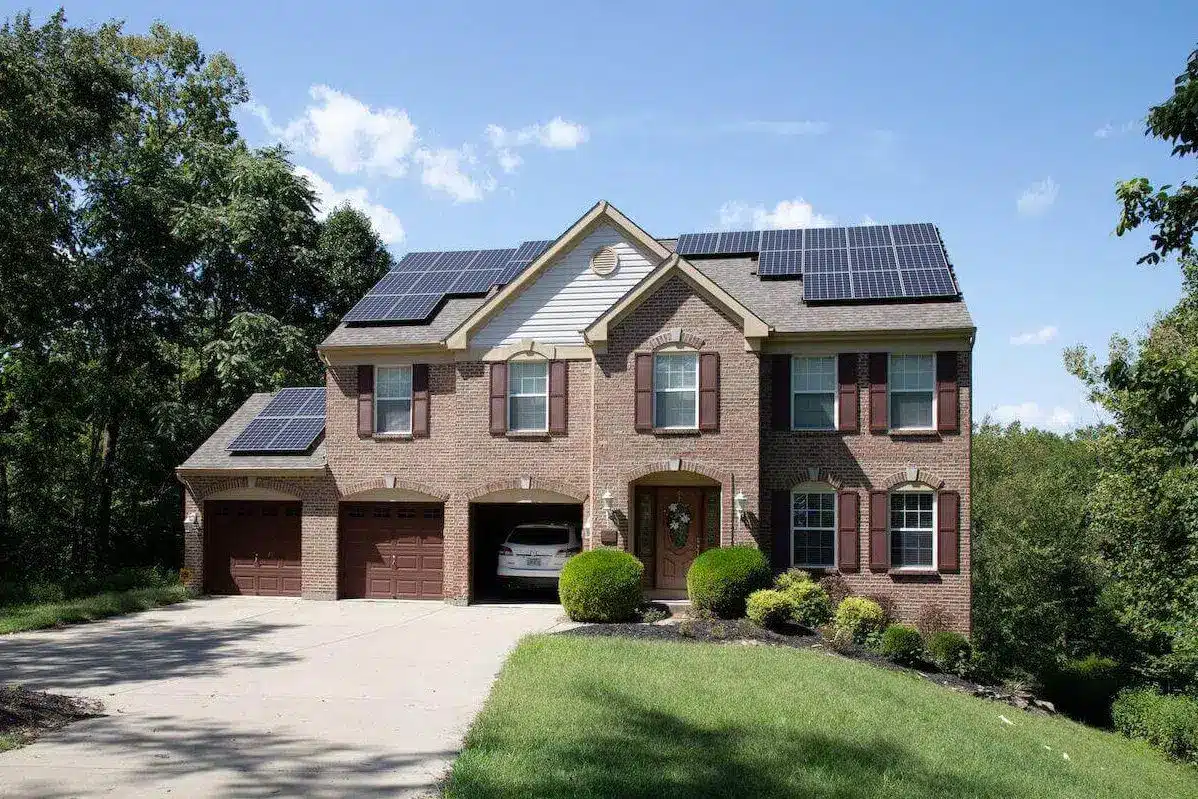 Stately home with solar panels on roof