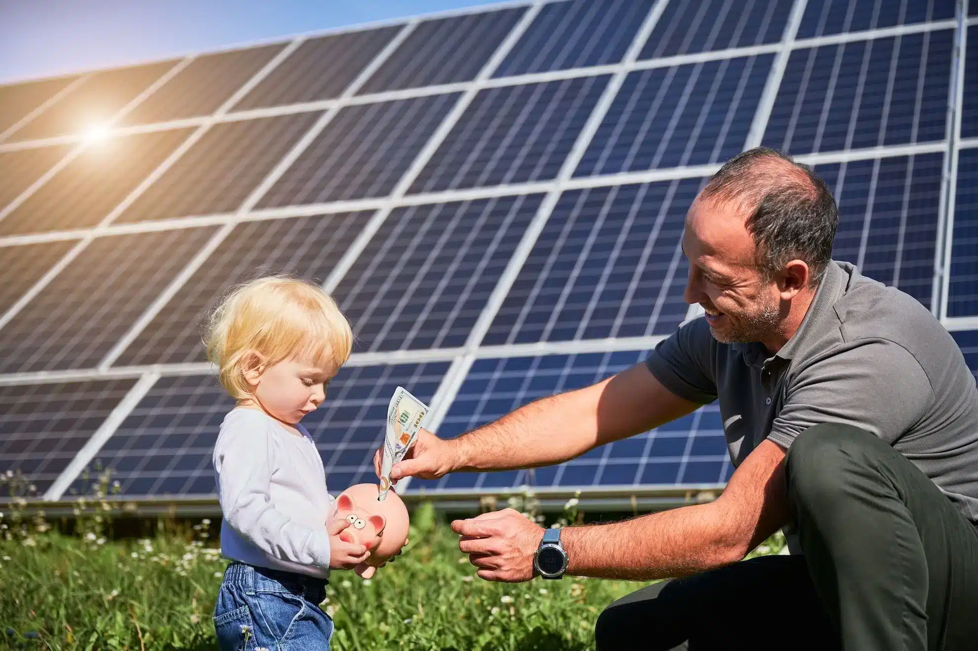 Father teaching child about solar savings