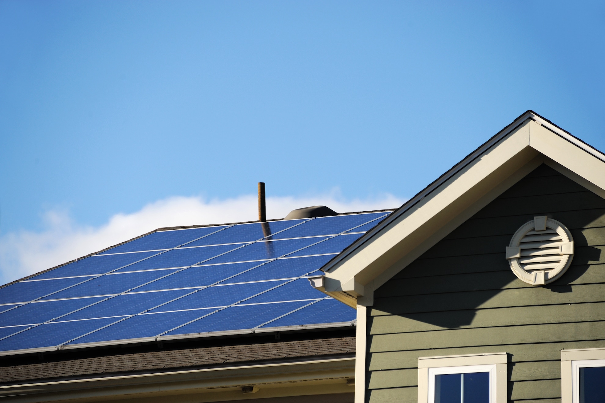 solar panels on rooftop of a green house